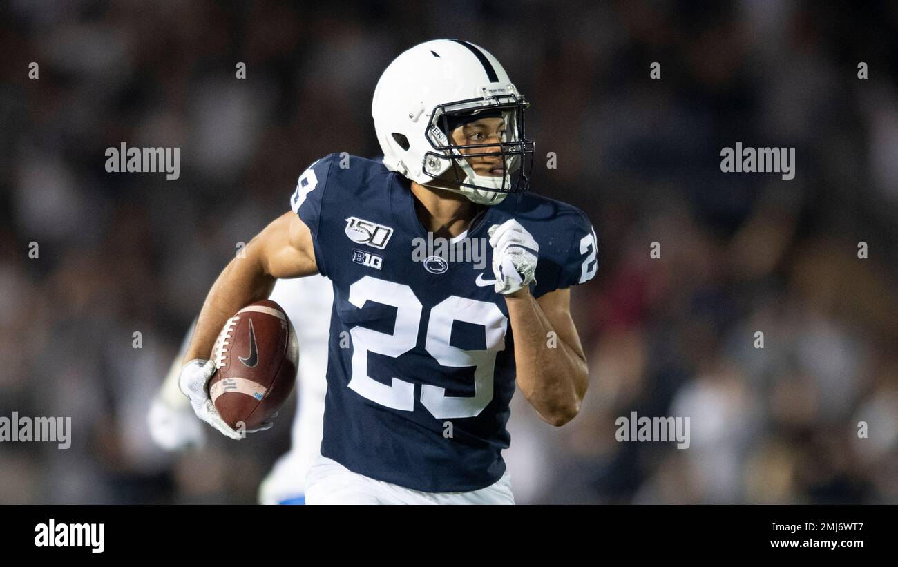 Penn State cornerback John Reid (29) returns an interception during an