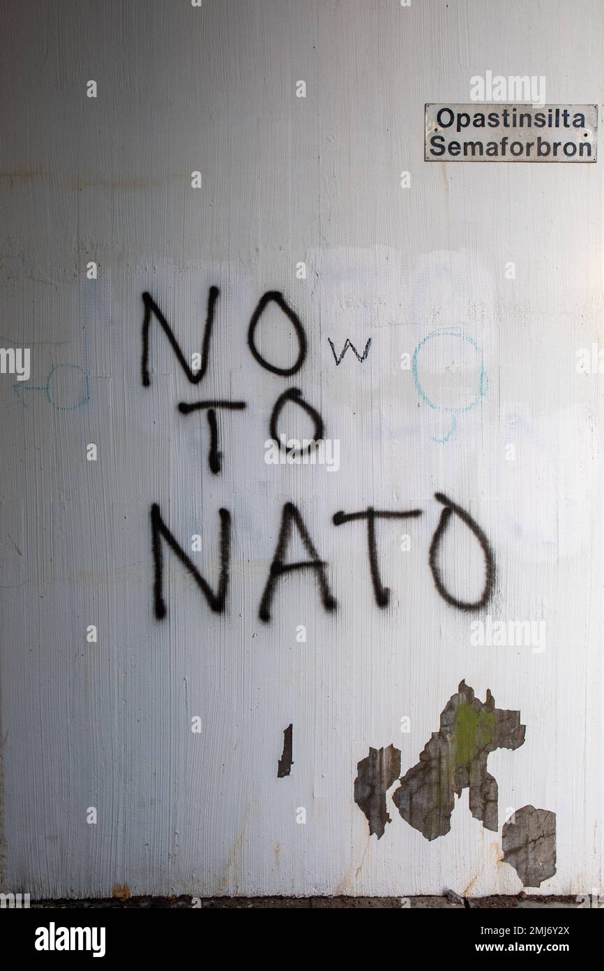 NO TO NATO / Now TO NATO. Altered message on the wall in Itä-Pasila district of Helsinki, Finland. Stock Photo
