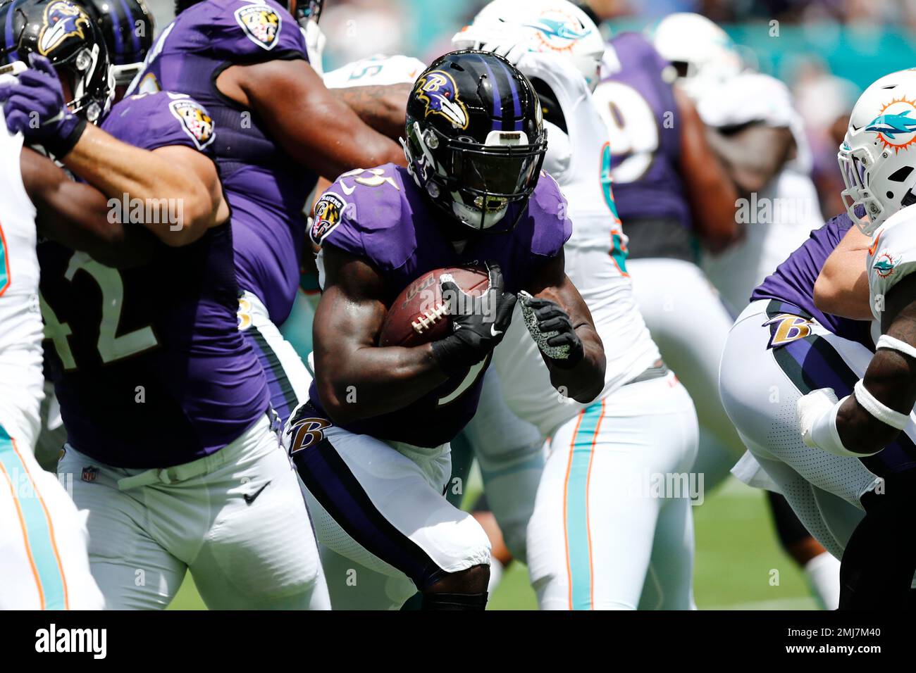 Baltimore Ravens running back Gus Edwards (35) runs with the ball