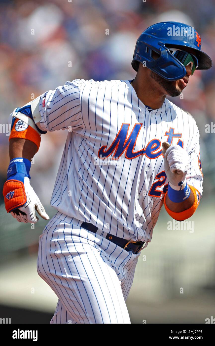 New York Mets' Robinson Cano trots the bases after hitting a solo home