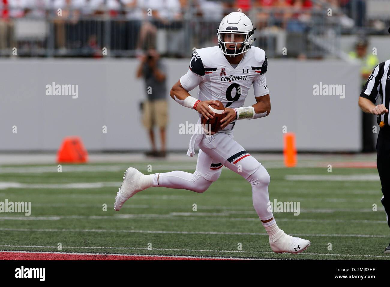 Desmond Ridder of the Cincinnati Bearcats looks to pass during the