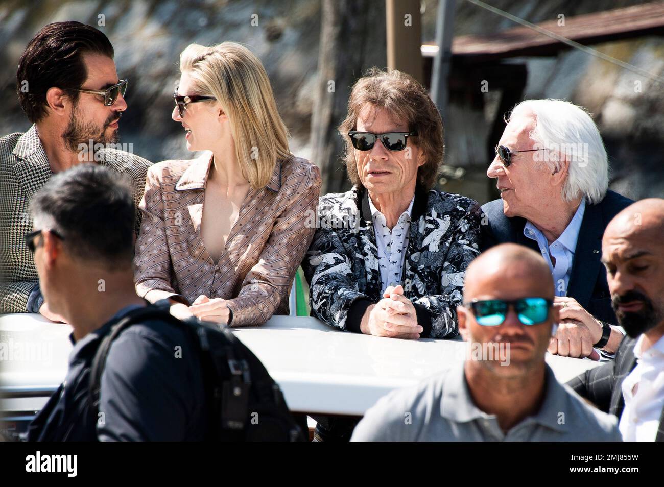 Actors Claes Bang, from left, Elizabeth Debicki, Mick Jagger and Donald  Sutherland pose for photographers upon arrival for the photo call of the  film 'The Burnt Orange Heresy' at the 76th edition