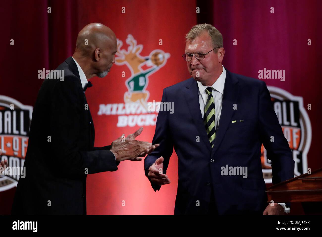 Inductee Jack Sikma, right, shakes hands with presenter Kareem Abdul ...