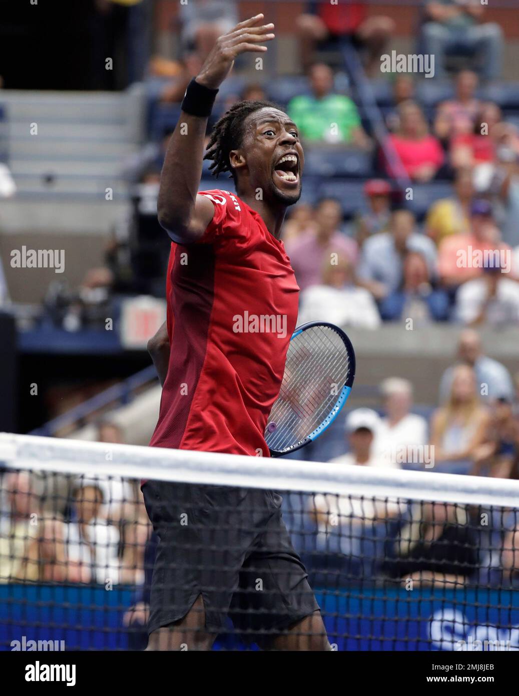 Gael Monfils, of France, reacts after winning a point against Matteo Berrettini, of Italy, during the quarterfinals of the U.S. Open tennis championships Wednesday, Sept