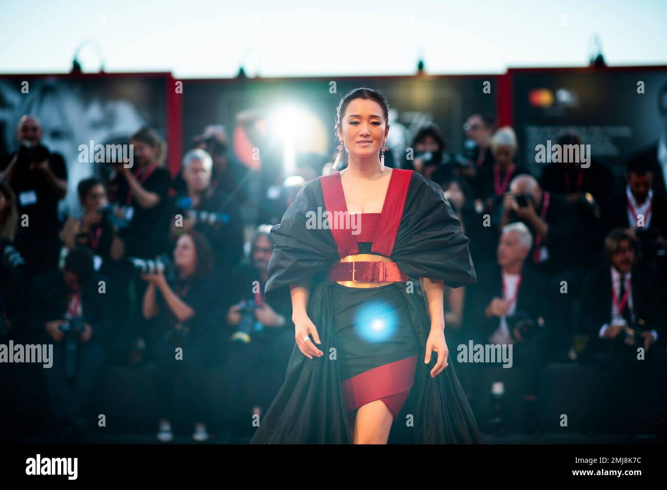 Actress Gong Li poses for photographers upon arrival at the premiere of