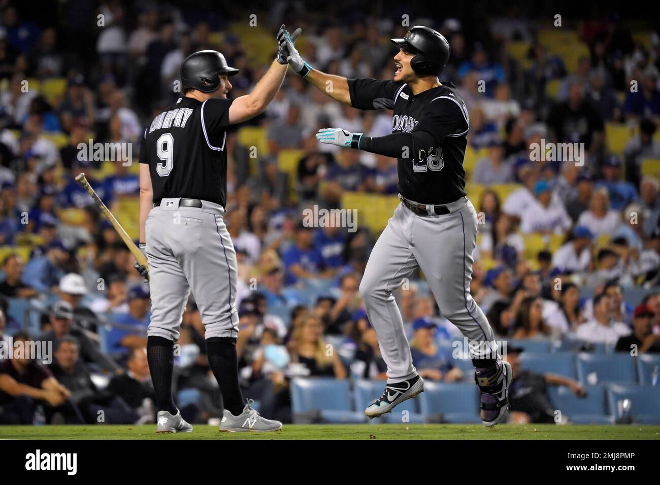 Colorado Rockies' Nolan Arenado celebrates his solo home run with