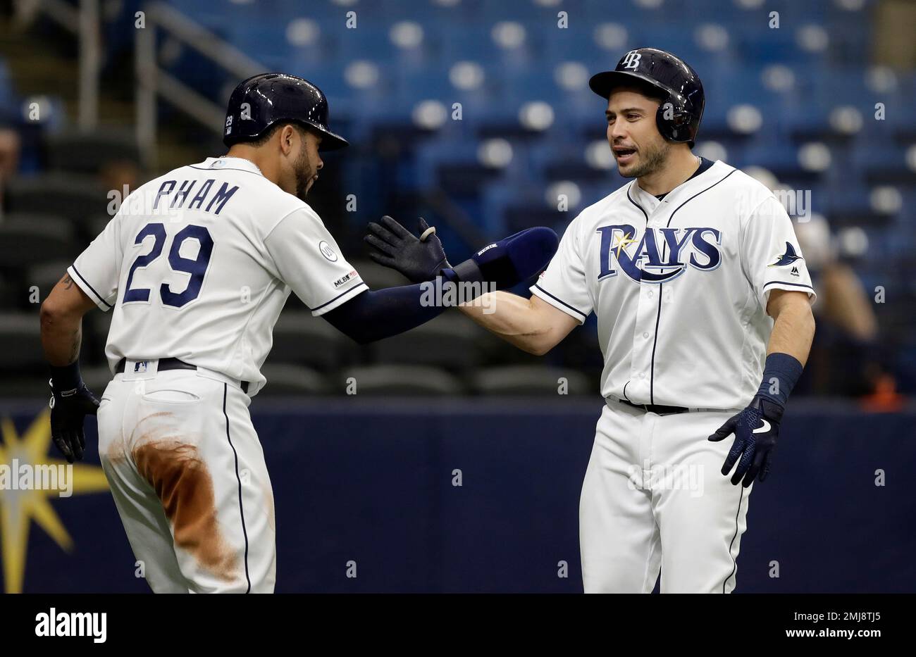Tampa Bay Rays' Travis d'Arnaud, right, celebrates with Tommy Pham