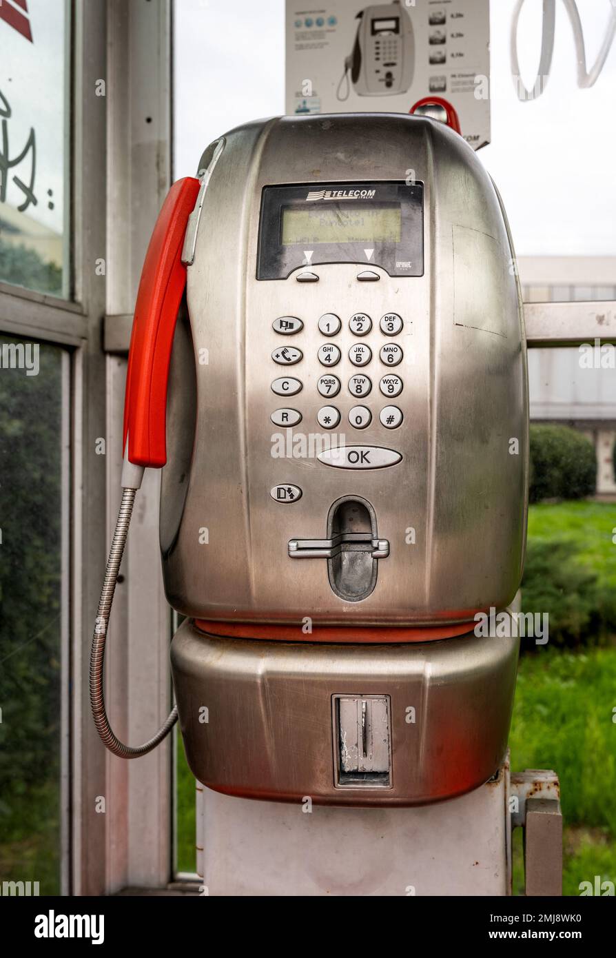 One of the last public telephone booth, owned by Telecom Italia company, Florence, Tuscany, Italy Stock Photo