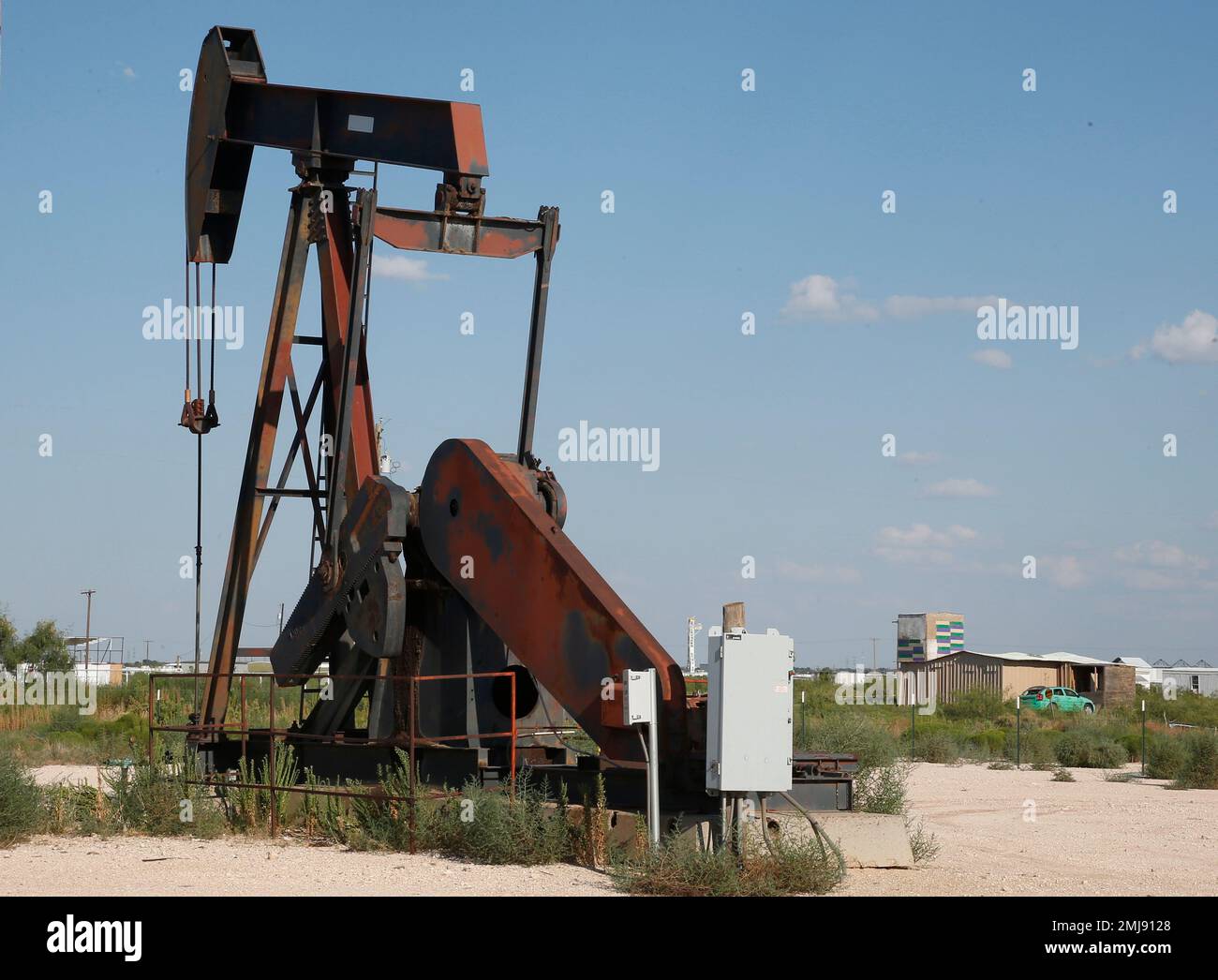 The home of Seth Ator, the alleged gunman in a West Texas rampage Saturday,  is seen to the right of a pump jack Monday, Sept. 2, 2019, near Odessa,  Texas. Officers killed