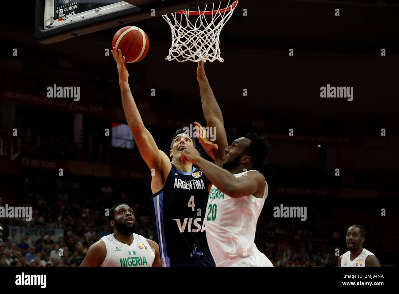 Luis Scola of Argentina goes up for a shot against Josh Okogie of Nigeria  during their group B in the FIBA Basketball World Cup, at the Sport Center  in Wuhan in central