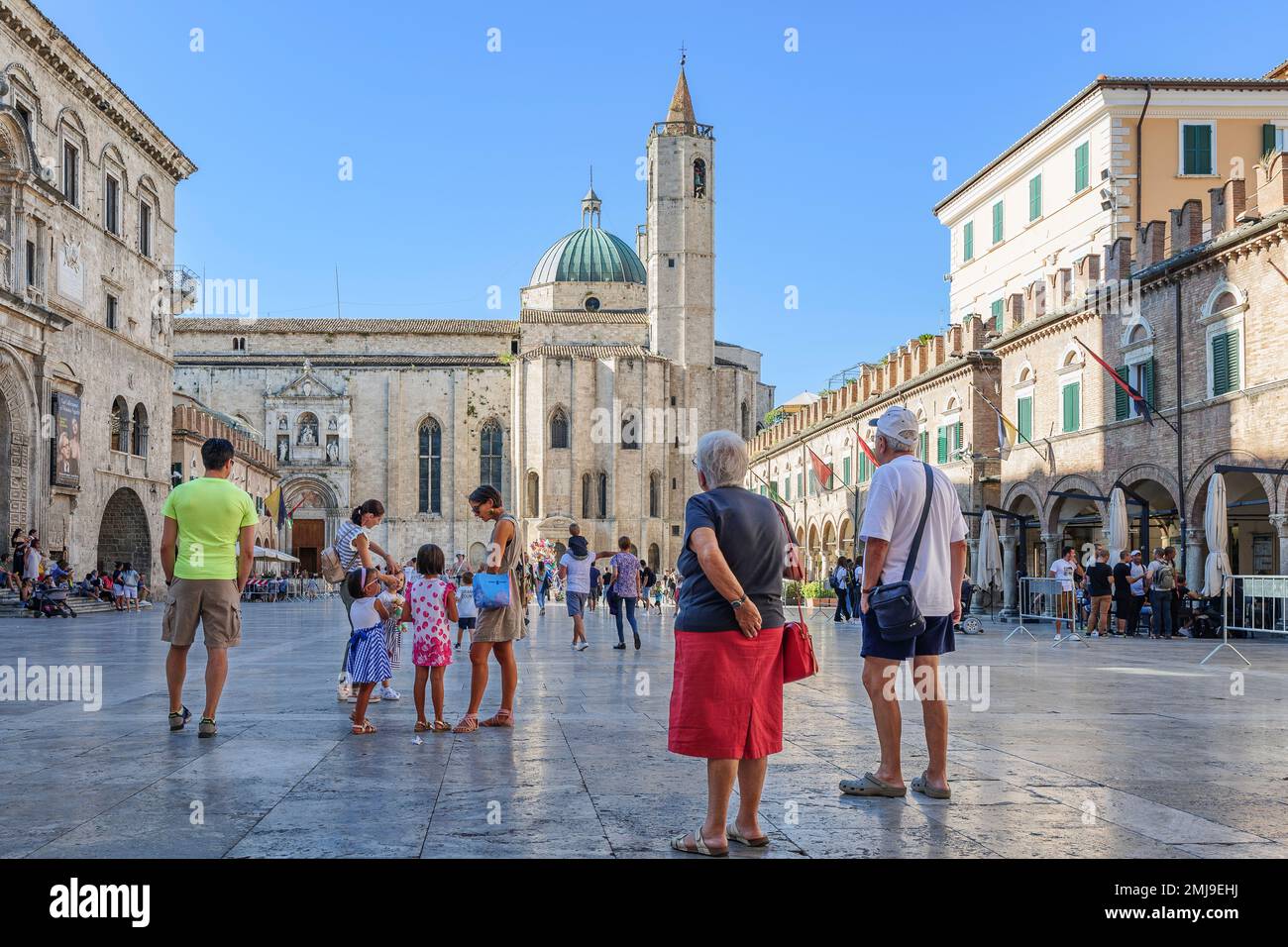 Tourists in Piazza del Popolo enjoy the architectural beauty and the pleasant shade on a day of the hottest summer recorded ever, 09 july 2023 - Ascol Stock Photo