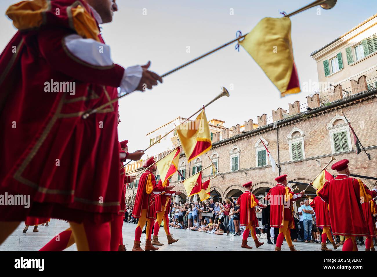 Parade of the medieval Quintana of Ascoli Piceno in Piazza del Popolo is admired every year by a considerable crowd of tourists who crowd civilly in t Stock Photo