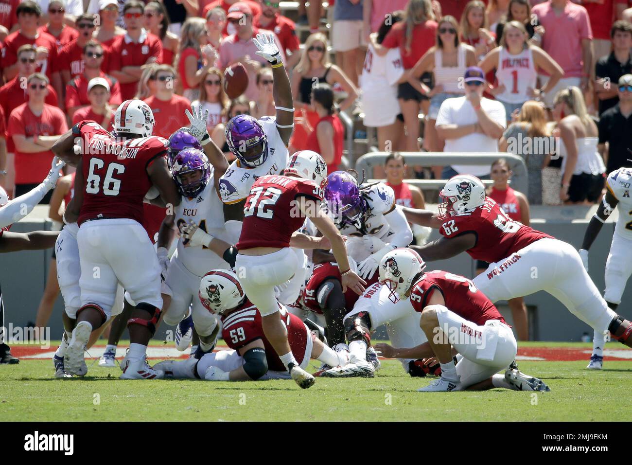 North Carolina State place kicker Christopher Dunn (32) kicks a field