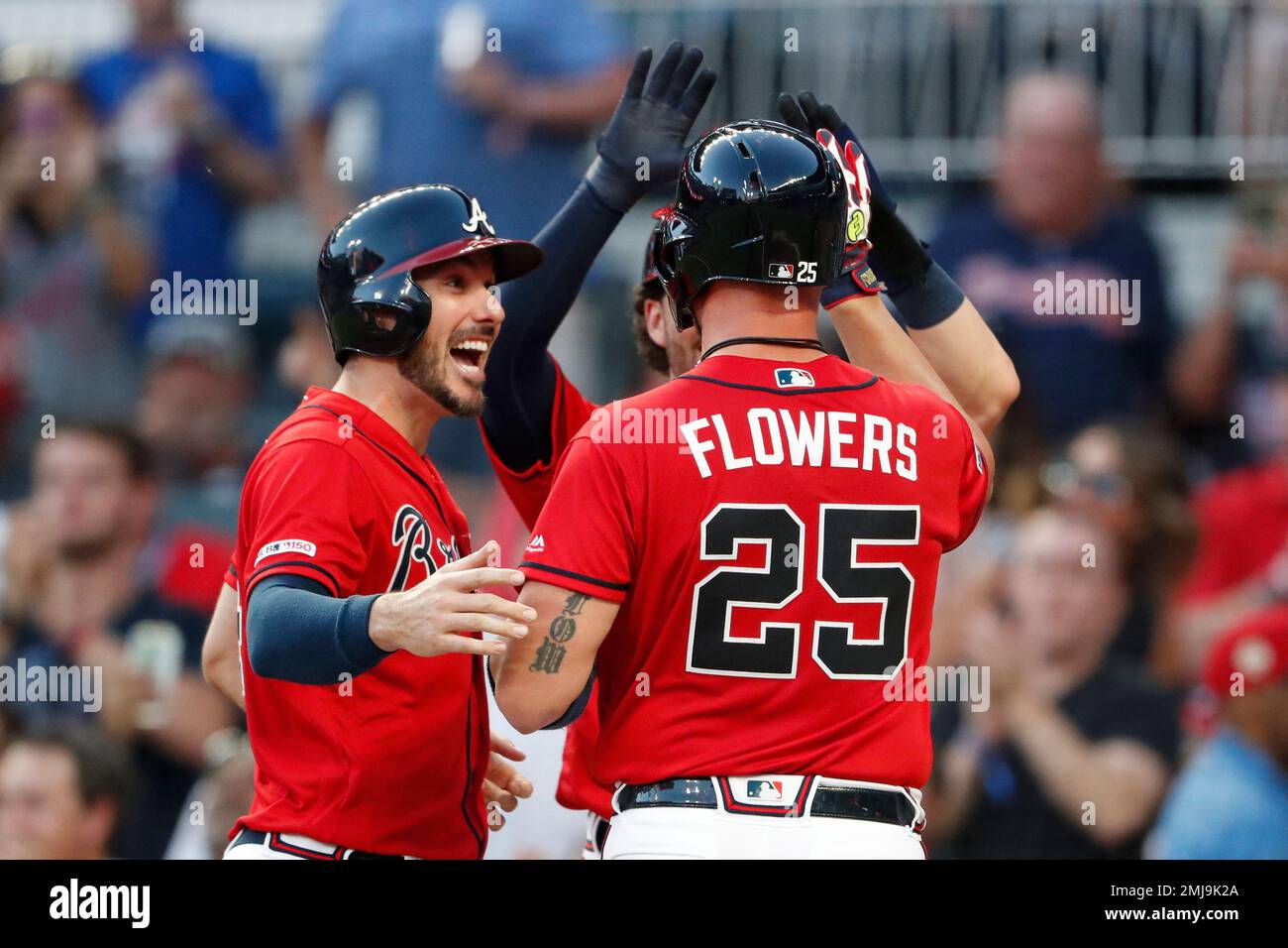 From left, Atlanta Braves catcher Tyler Flowers, left, shortstop