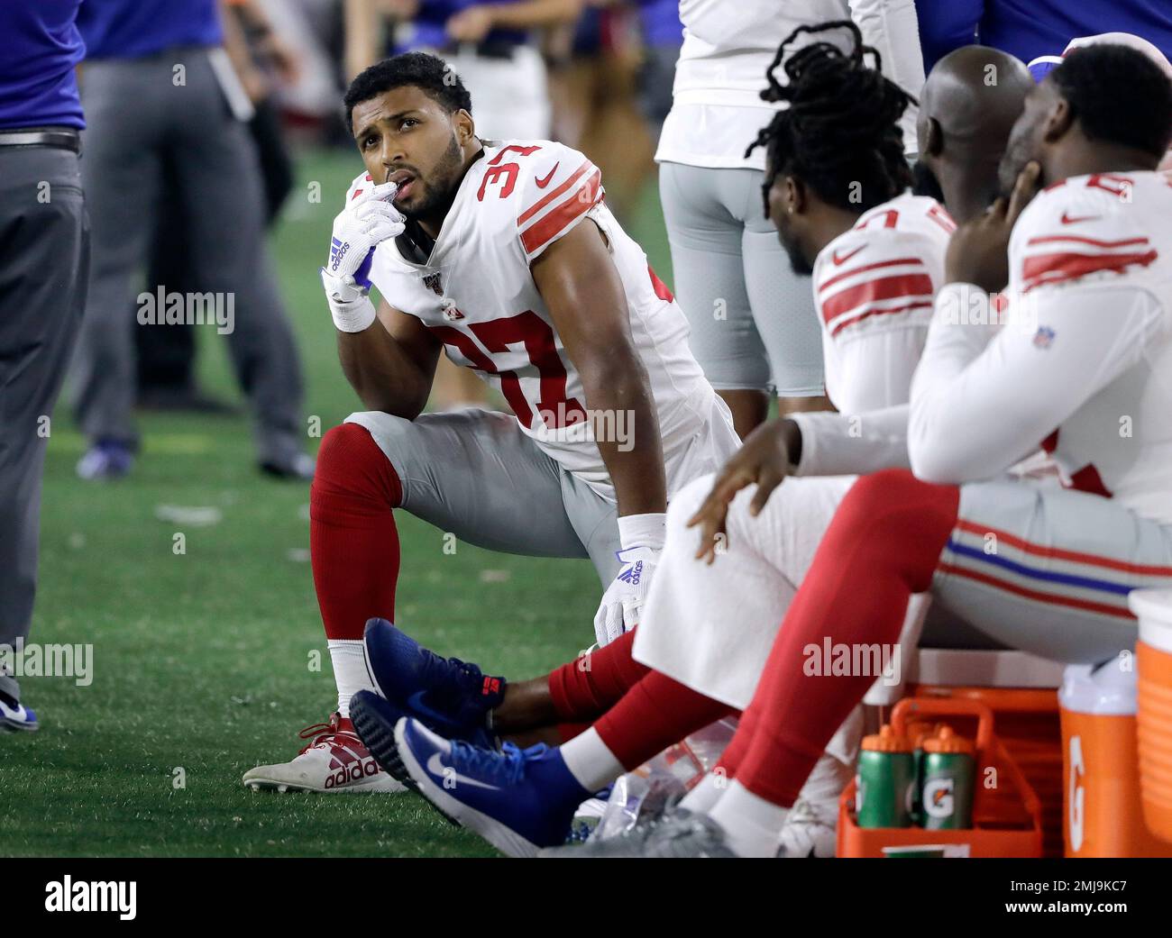 New York Giants cornerback Julian Love (37) tackles New England Patriots  wide receiver Julian Edelman in the first half of an NFL preseason football  game, Thursday, Aug. 29, 2019, in Foxborough, Mass. (