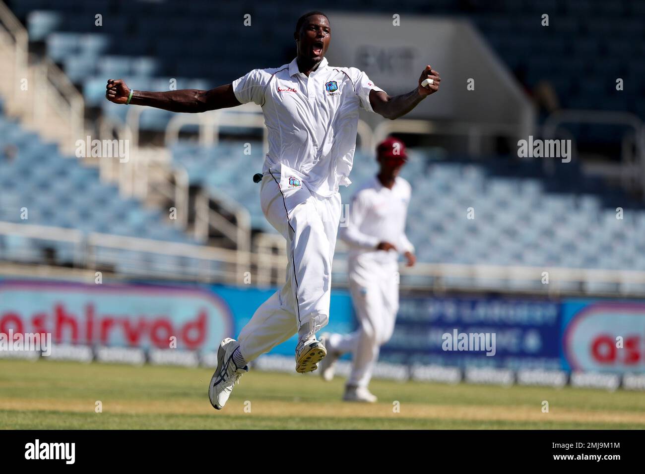 West Indies' captain Jason Holder celebrates taking the wicket of India's captain Virat Kohli