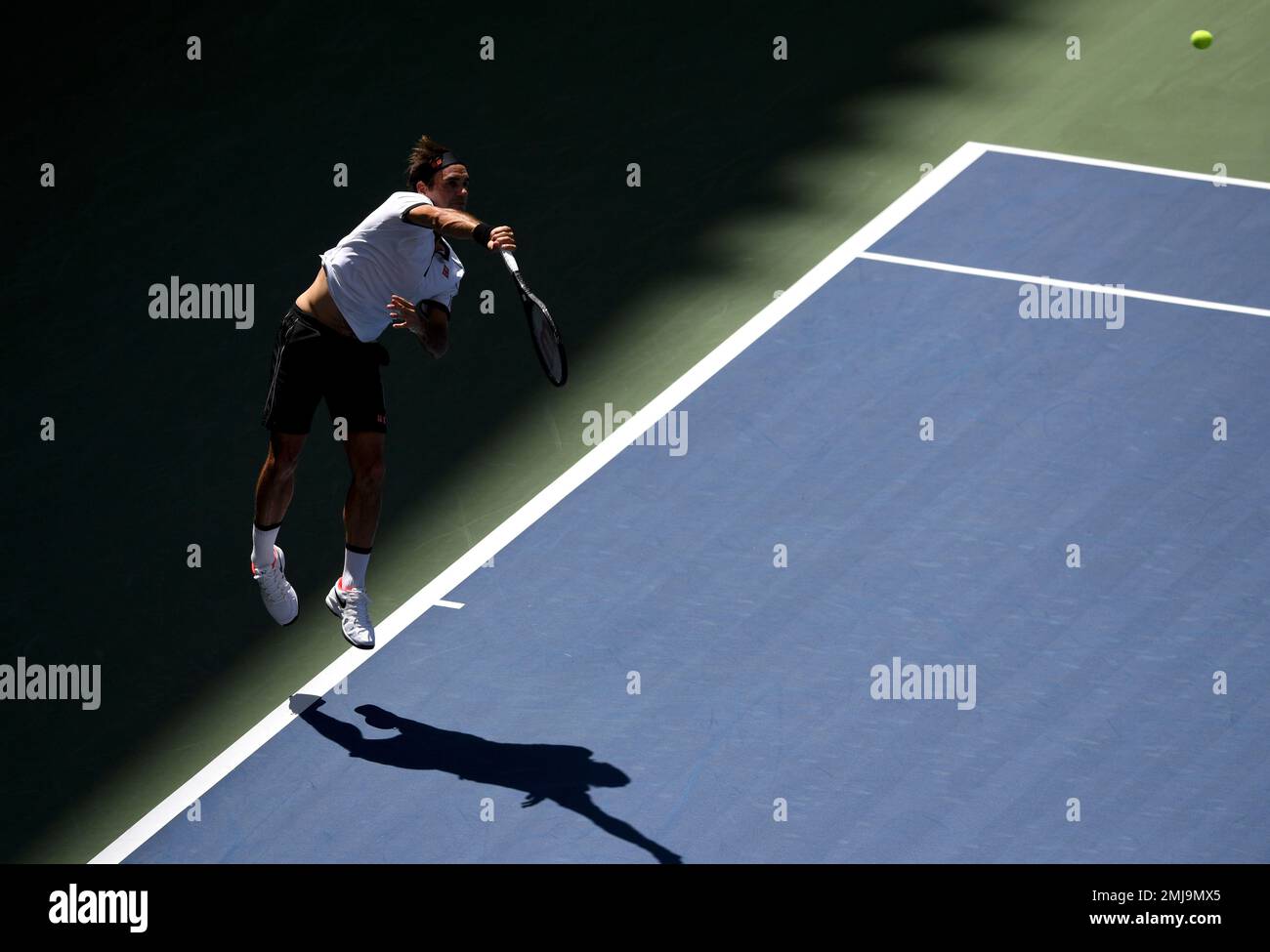 Roger Federer, of Switzerland, serves to Daniel Evans, of the United  Kingdom, during round three of the US Open tennis championships Friday,  Aug. 30, 2019, in New York. (AP Photo/Sarah Stier Stock