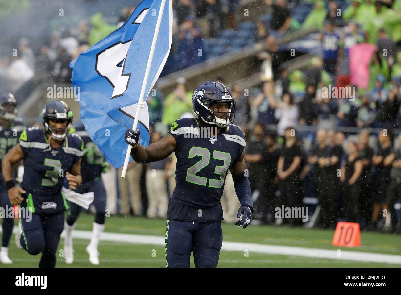 Seattle, WA, USA. 3rd Oct, 2019. Seattle Seahawks cornerback Neiko Thorpe  (23) carries the ''12'' flag before a game between the Los Angeles Rams and  Seattle Seahawks at CenturyLink Field in Seattle