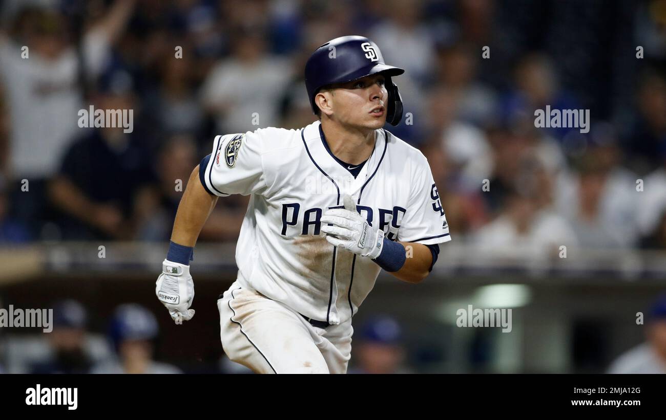 San Diego Padres' Luis Urias lines out while batting during the ninth  inning of a baseball game against the Los Angeles Dodgers Wednesday, Aug.  28, 2019, in San Diego. (AP Photo/Gregory Bull