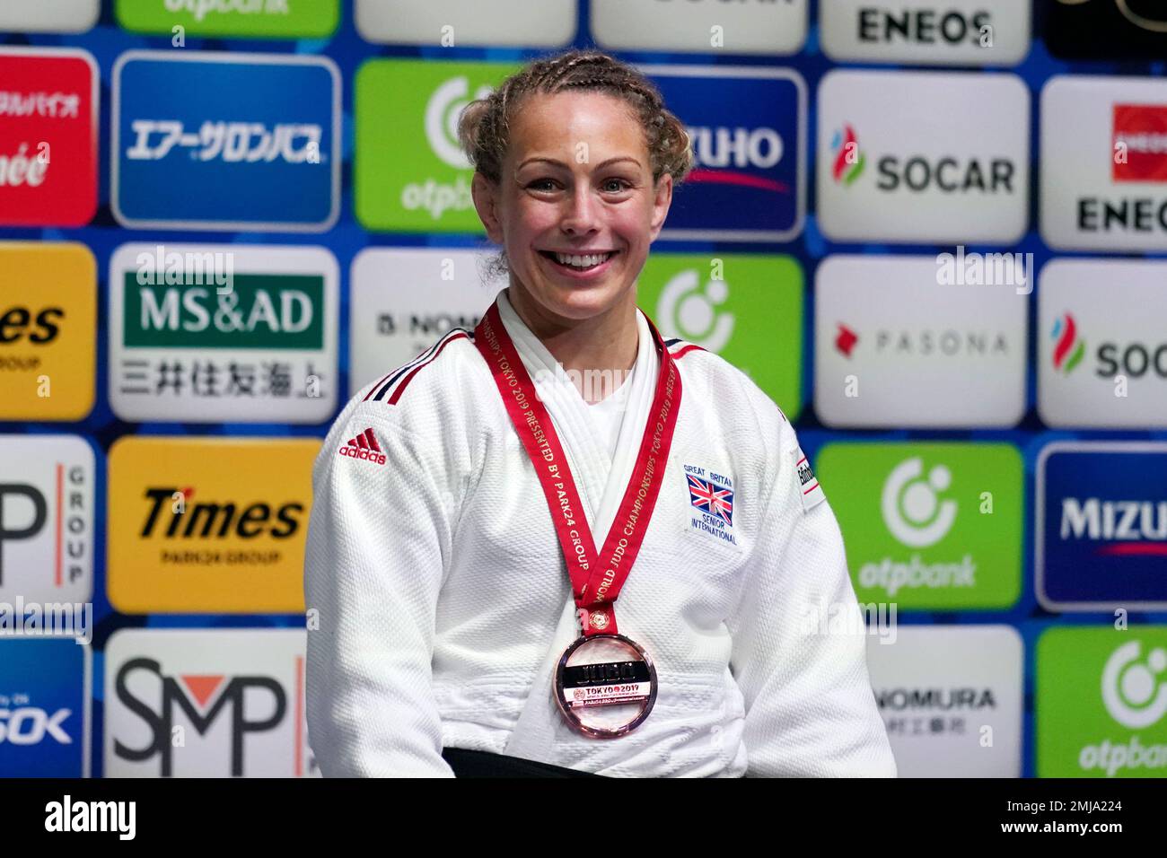 Britain's Sally Conway poses with her bronze medal for a photo during