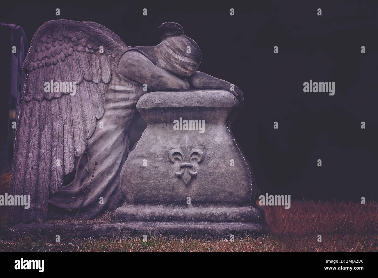 A weeping angel is pictured in St. Rose of Lima Cemetery, Jan. 1, 2023, in Coden, Alabama. Holidays are difficult for those who have lost loved ones. Stock Photo