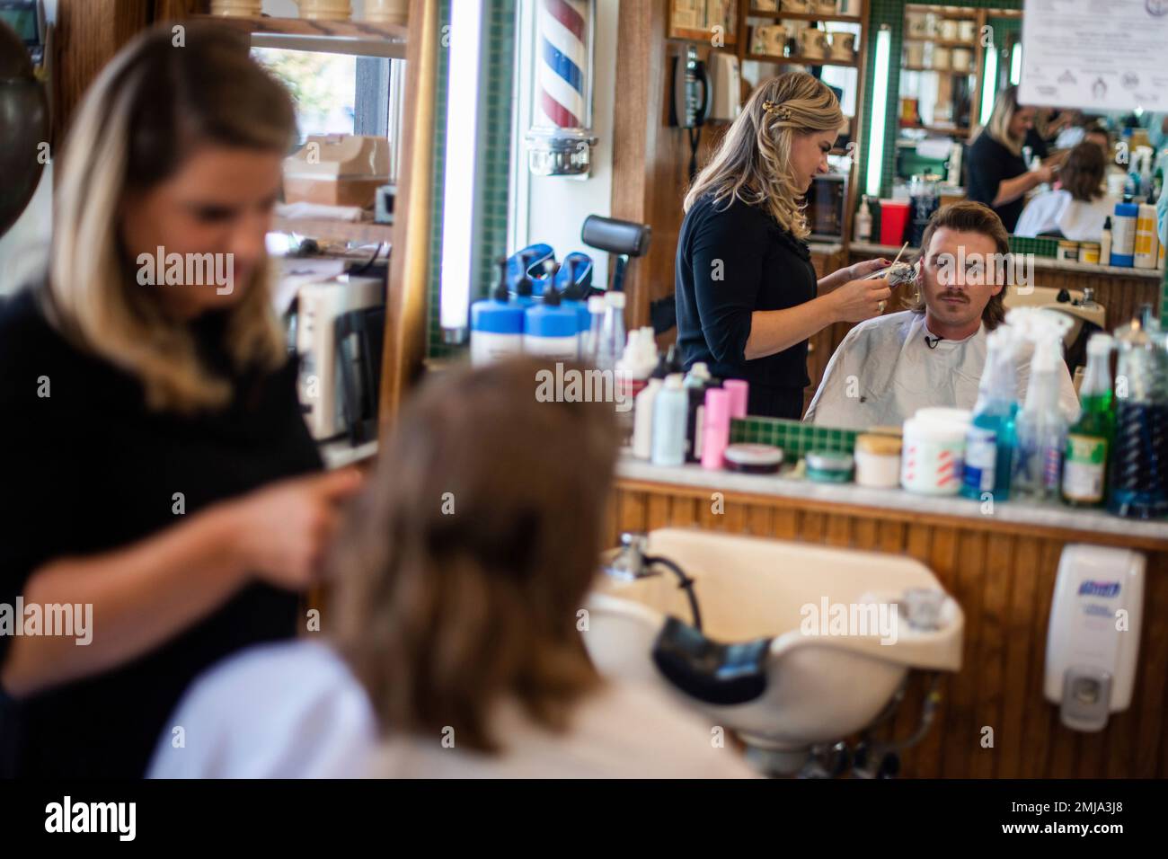 Country singer Wallen receives a mullet at Paul Mole Barber Shop
