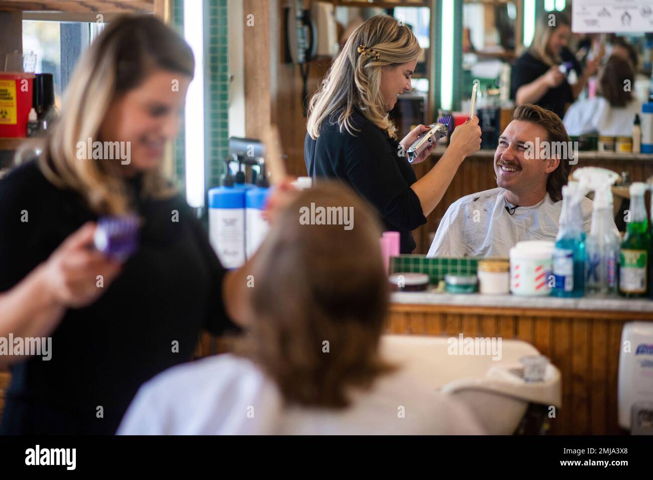 Country singer Wallen receives a mullet at Paul Mole Barber Shop