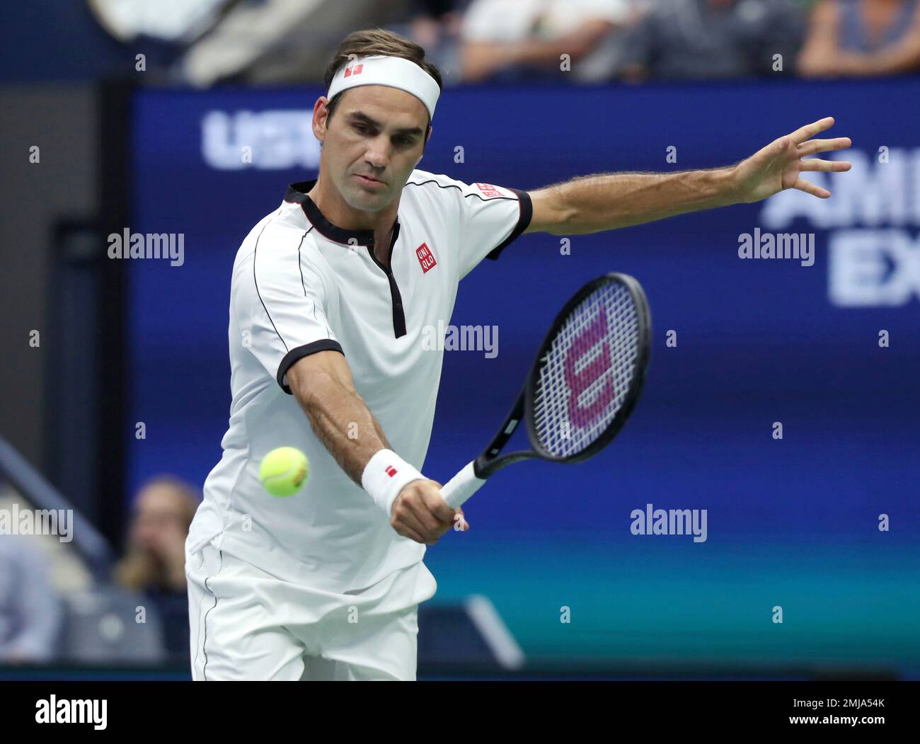 Roger Federer, of Switzerland, returns a shot to Damir Dzumhur, of Bosnia,  during the second round of the US Open tennis championships Wednesday, Aug.  28, 2019, in New York. (AP Photo/Eduardo Munoz