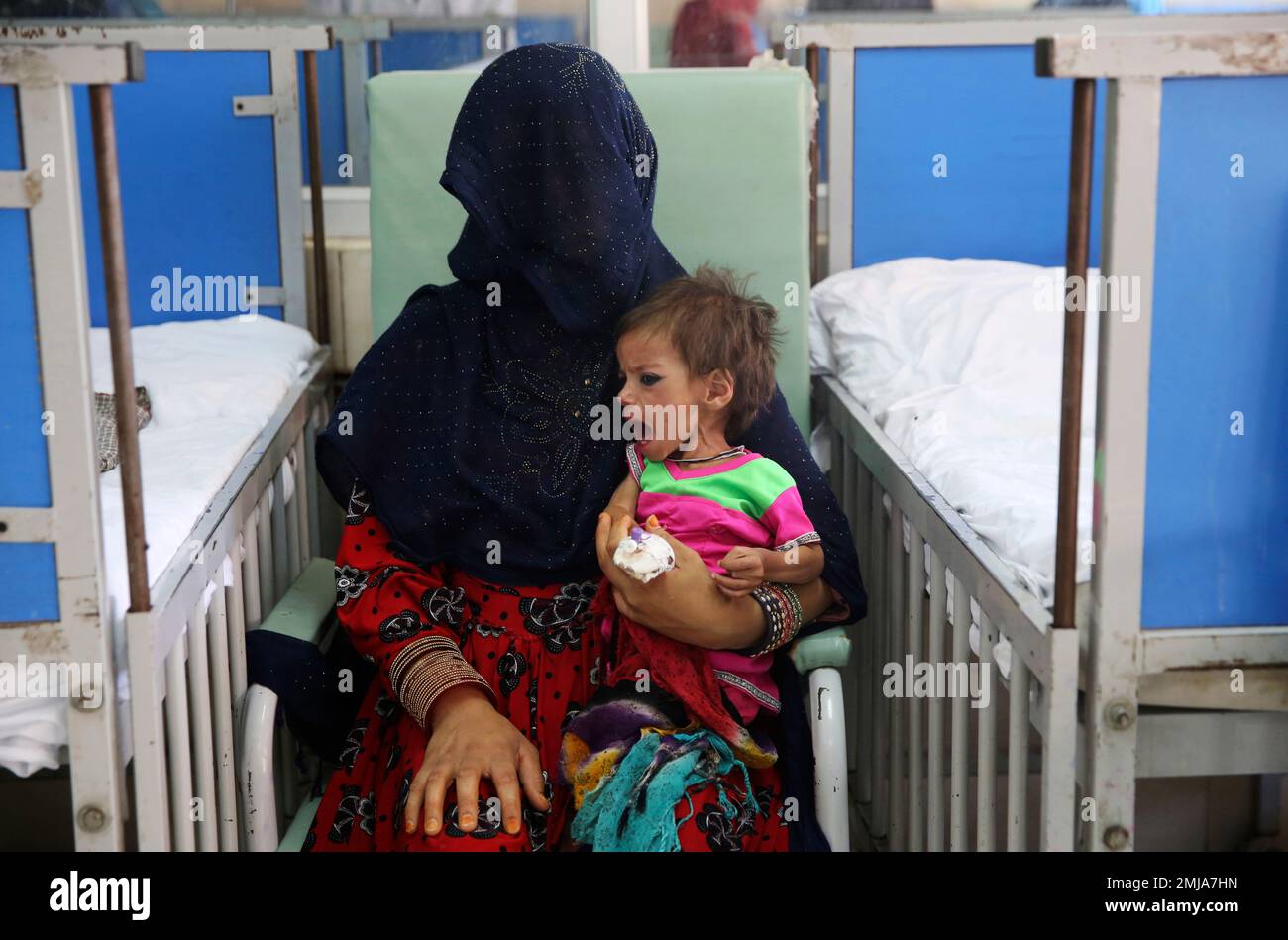 In This Aug 21 2019 Photo A Woman Holds Her Malnourished Girl In A Ward At The Indira Gandhi