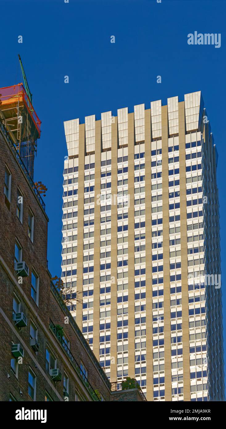 The Langham New York sports a flared stainless steel crown to hide mechanical details; the façade’s strong vertical lines emphasize height. Stock Photo