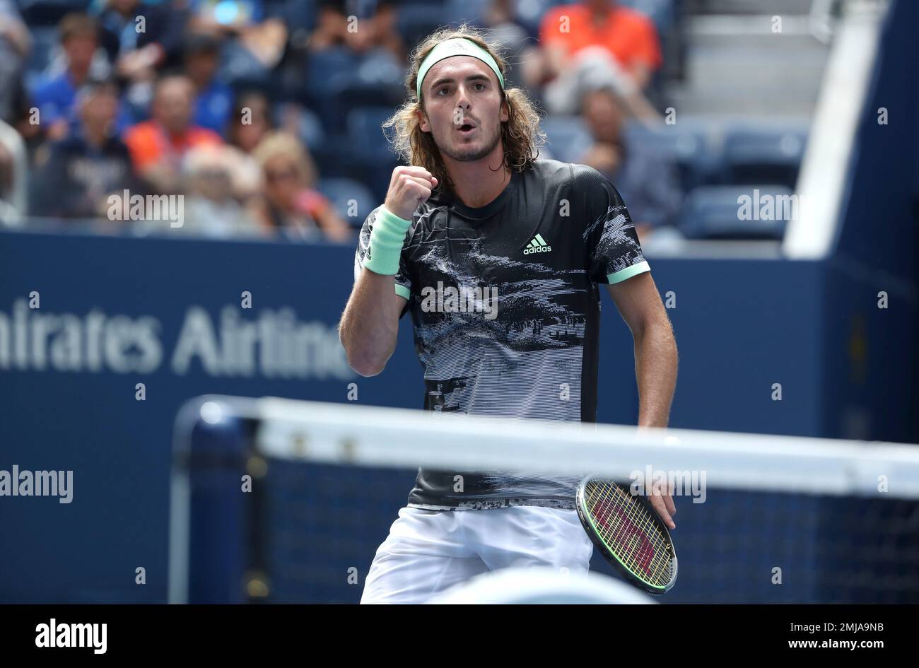 Stefanos Tsitsipas, of Greece, reacts after scoring a point against Andrey Rublev, of Russia, during the first round of the US Open tennis tournament Tuesday, Aug