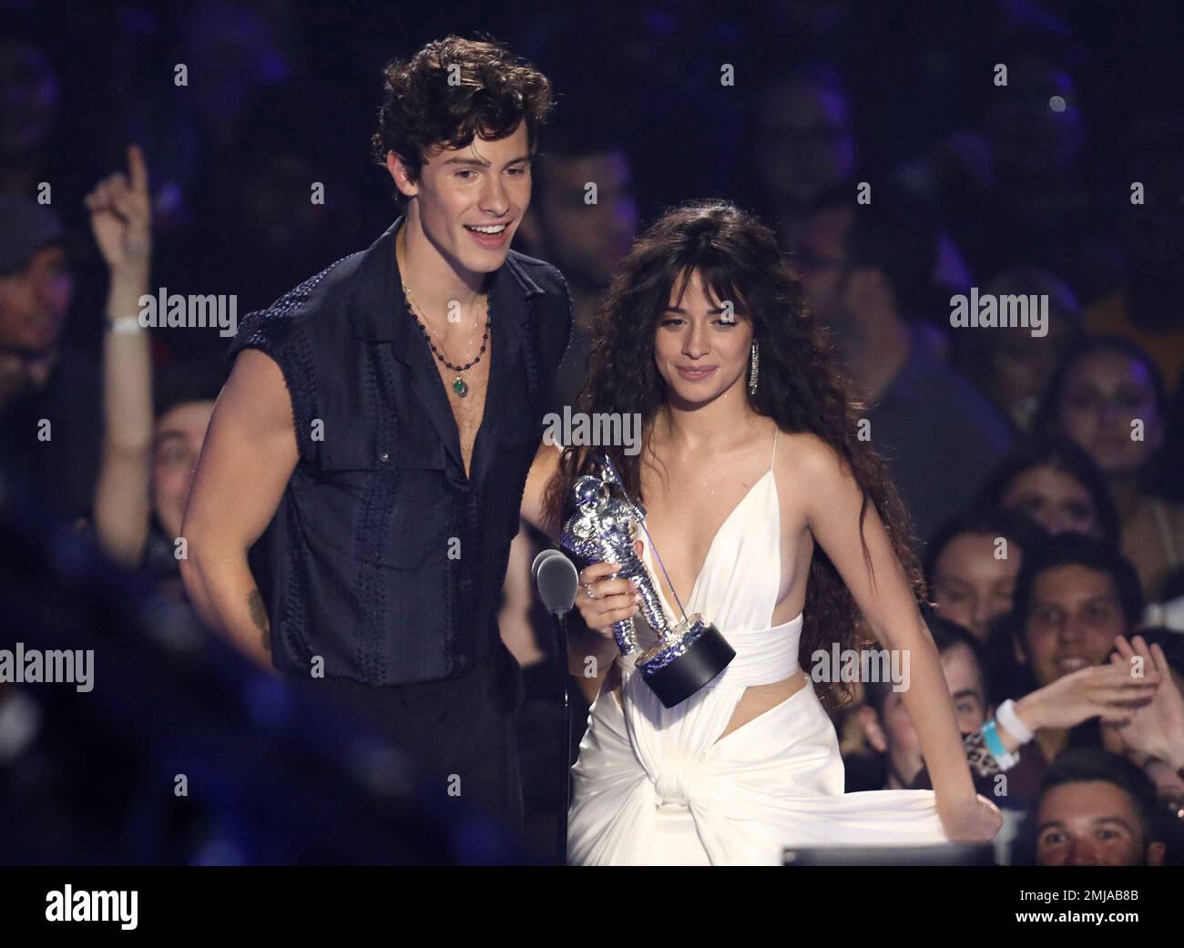 Shawn Mendes, left, and Camila Cabello accept the award for best(02)