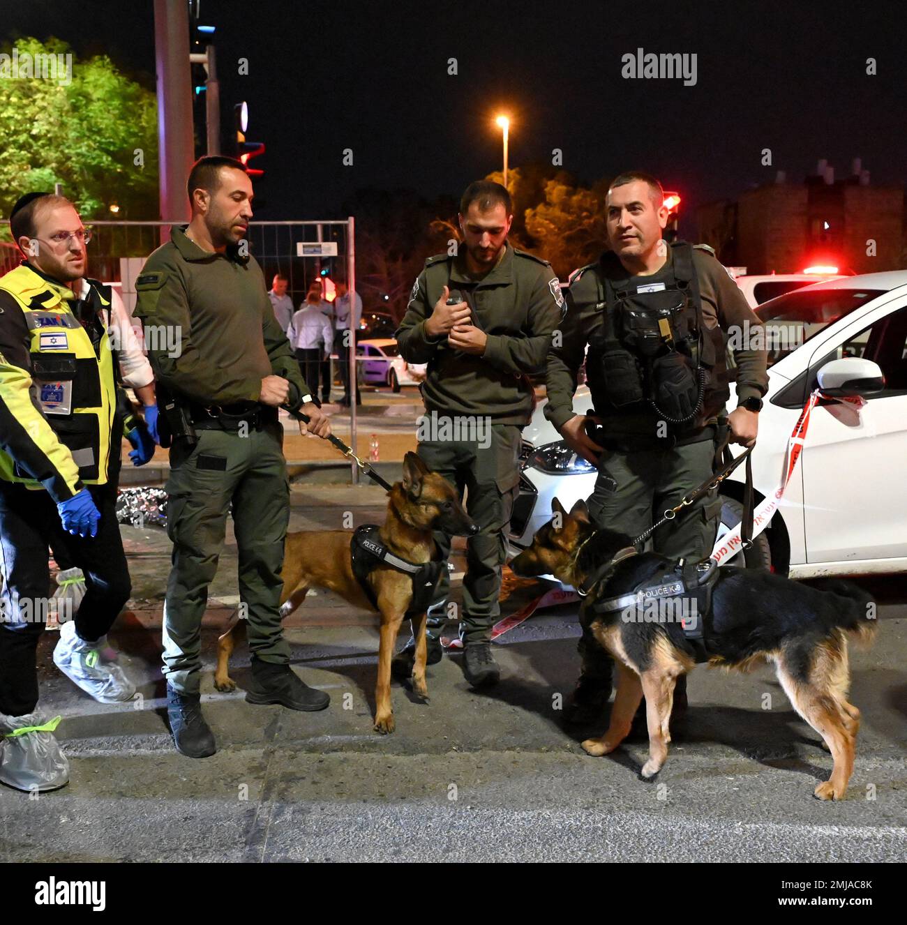Jerusalem, Israel. 27th Jan, 2023. Israeli forces with dogs stand at the scene of a terror attack at a synagogue that killed seven and wounded three in Neve Yaakov neighborhood in Jerusalem, on Friday, January 27, 2023. Palestinian Alkam Khairi from East Jerusalem opened fire at people leaving a synagogue after Friday night prayers. He was killed by police. Photo by Debbie Hill/ Credit: UPI/Alamy Live News Stock Photo