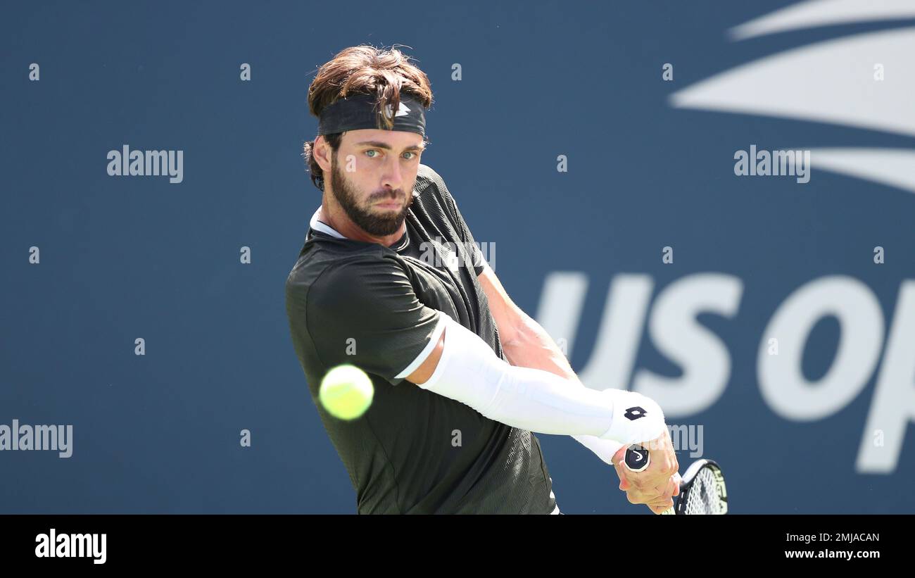Nikoloz Basilashvili, of Georgia, returns a shot during the first round of the US Open tennis tournament, Monday, Aug