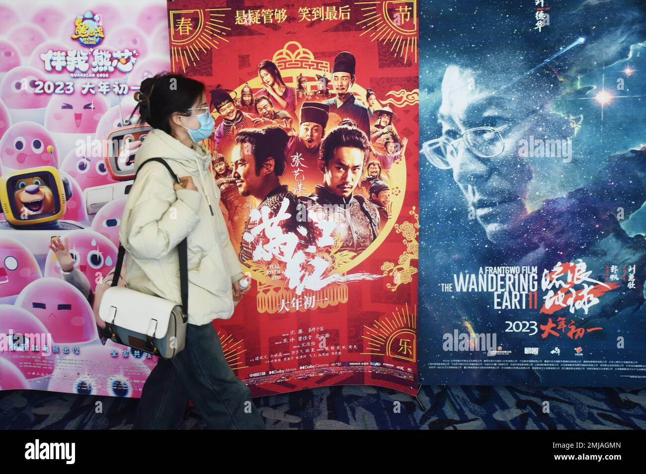 HANGZHOU, CHINA JANUARY 27, 2023 People walk past a movie poster