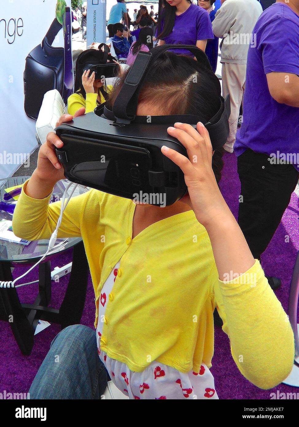 A girl playing with VR headset Stock Photo