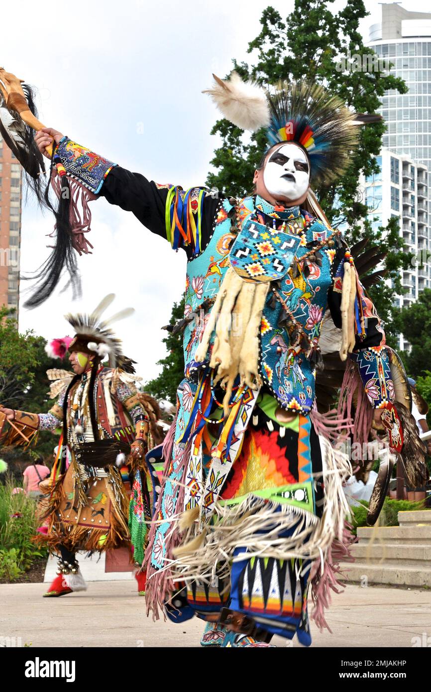 Indigenous native People in traditional Native Canadian clothing performing the traditional dance on Canada Day Stock Photo