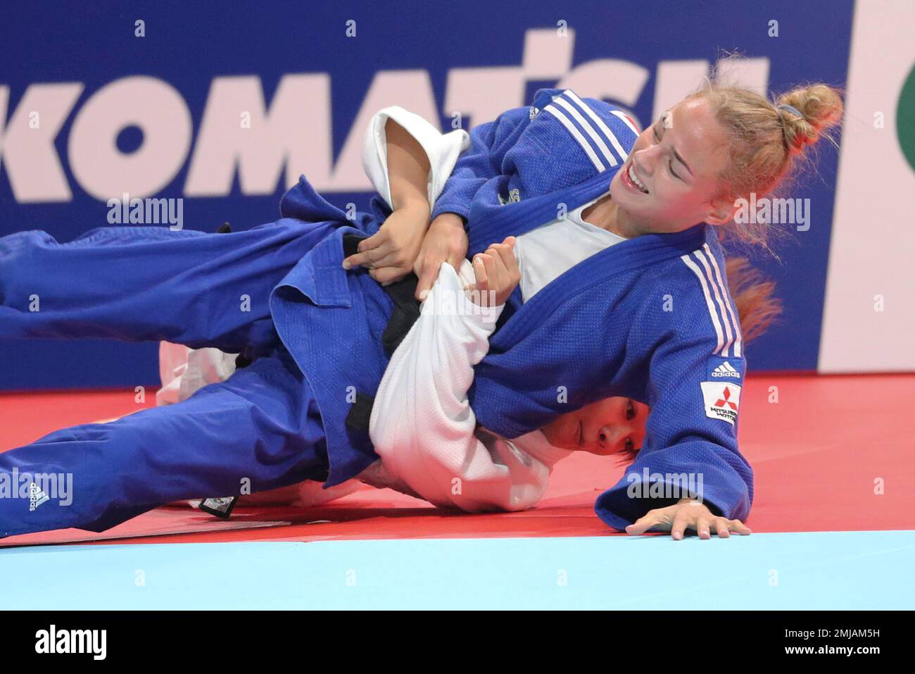 Funa Tonaki of Japan, rear, competes against Daria Bilodid of Ukraine during a womens -48 kilogram final of the World Judo Championships in Tokyo, Sunday, Aug