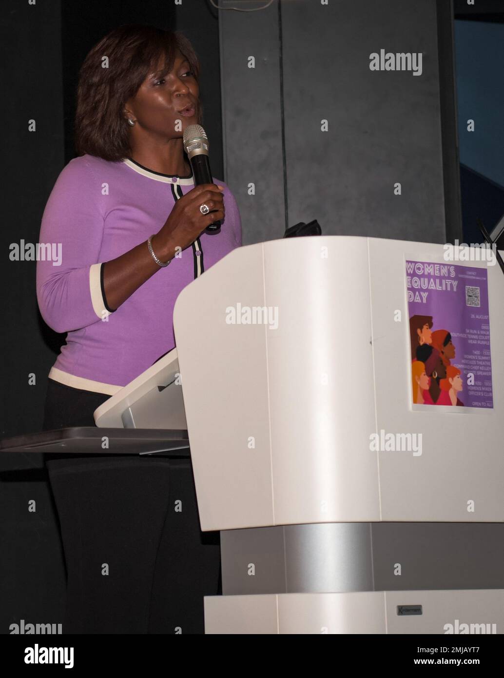 Nataki Jones, 86th Airlift Wing key spouse, addresses attendees at the Kaiserslautern Military Community Women’s Empowerment Summit held at Ramstein Air Base, Germany, Aug. 26, 2022. Jones spoke of the integral role spouses play in the military support system. Stock Photo