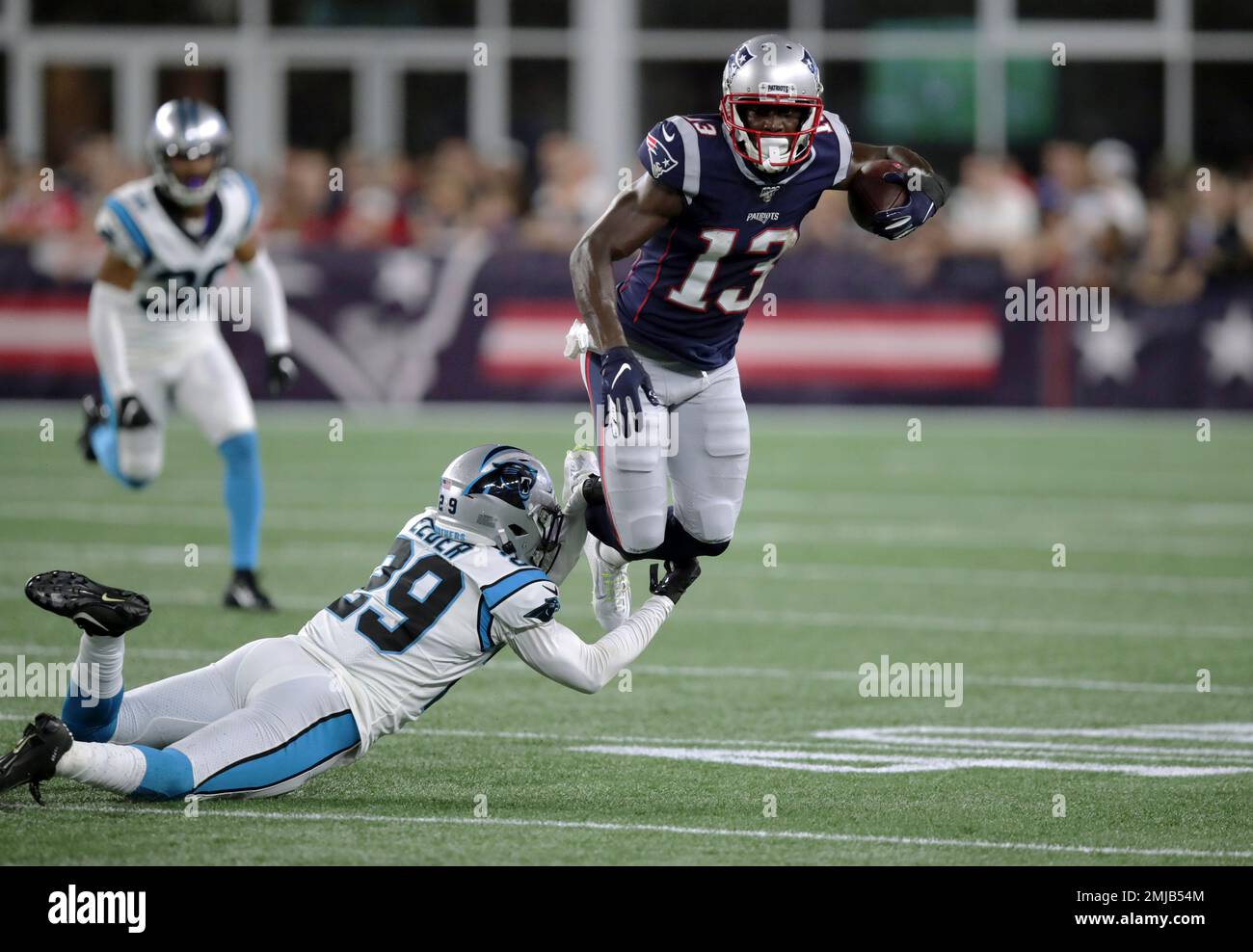 Carolina Panthers cornerback Corn Elder (29) tackles New England