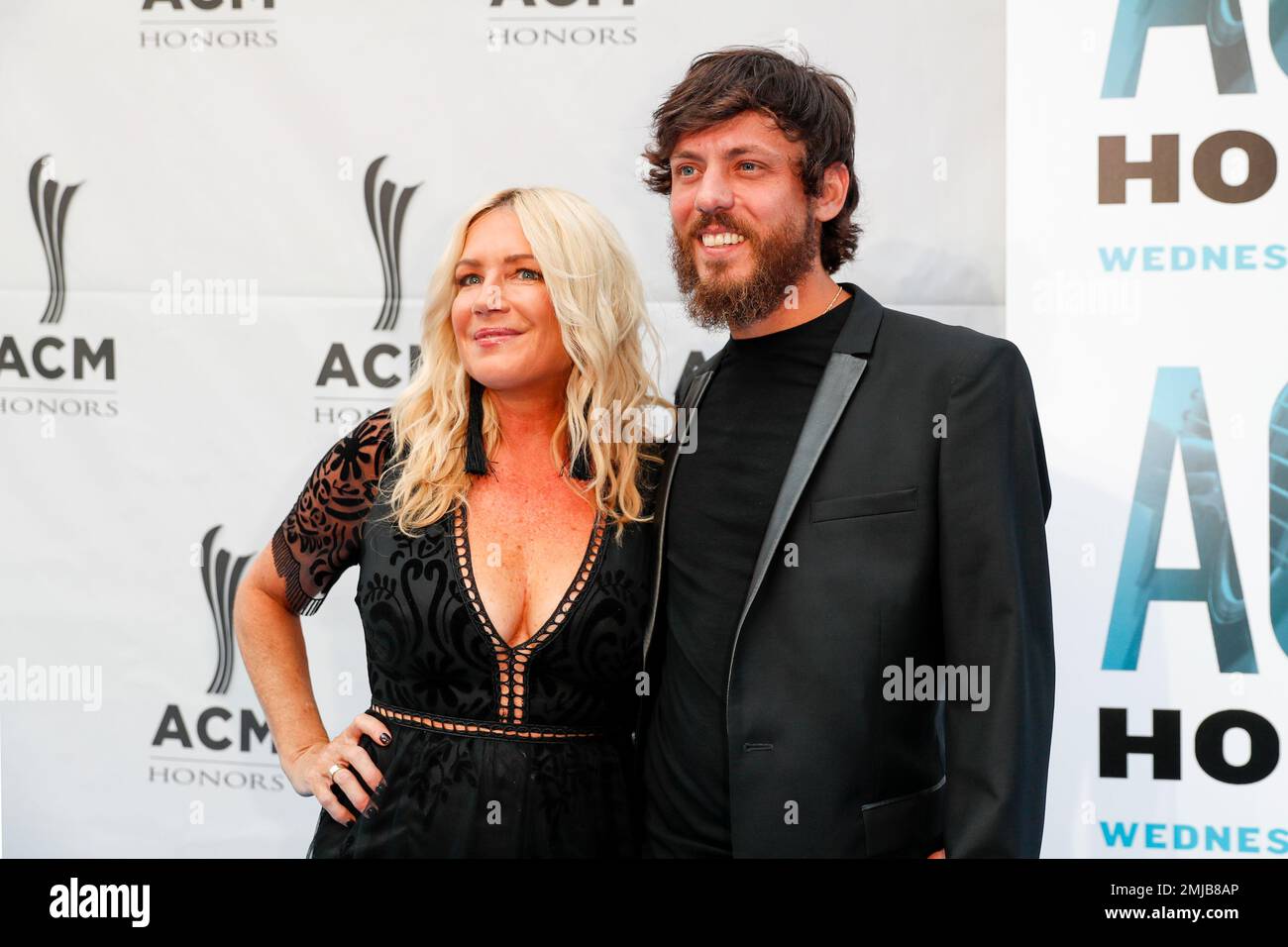 Chris Janson, right, and his wife, Kelly Lynn, arrive at the 13th