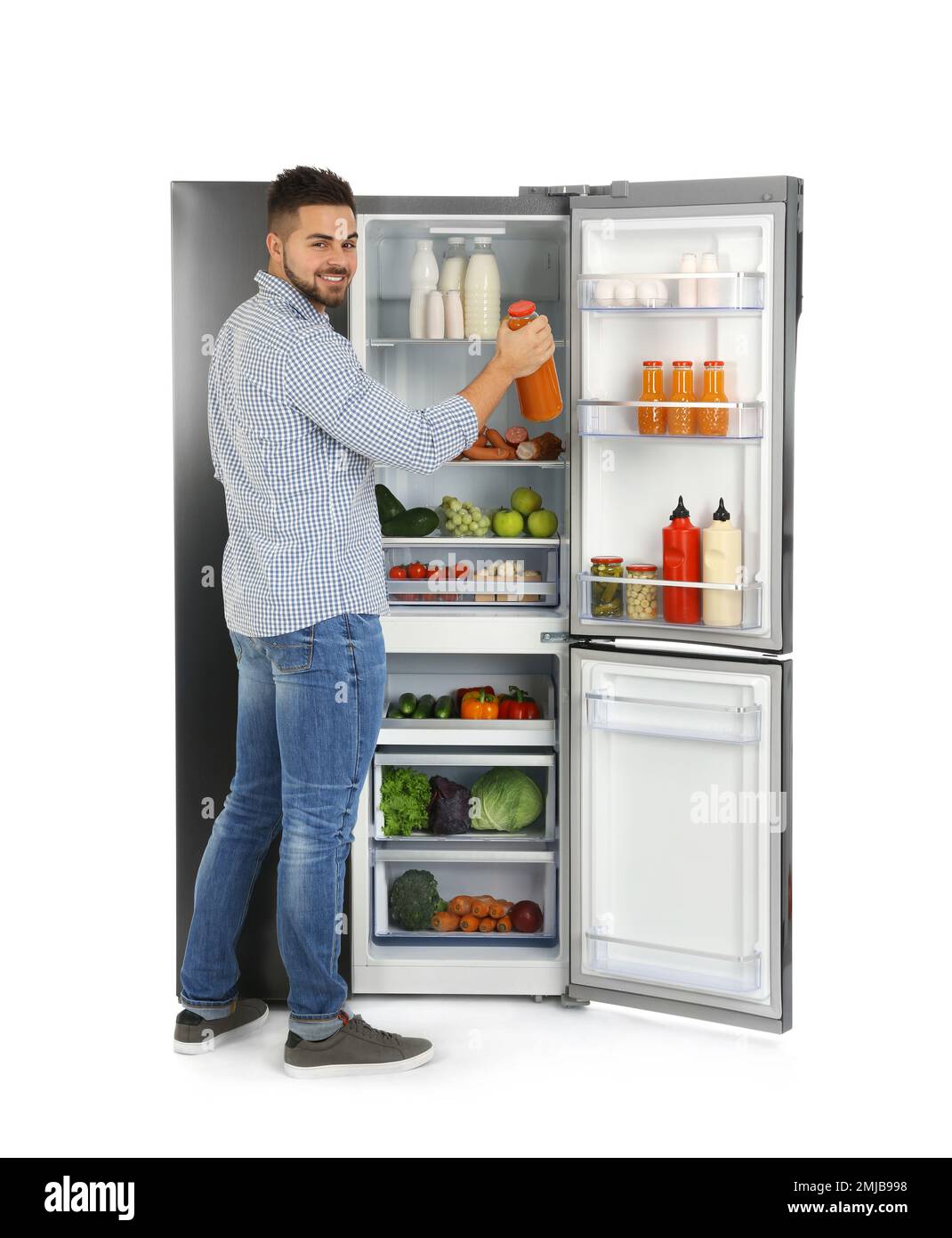 Orange juice bottles in refrigerator Stock Photo - Alamy