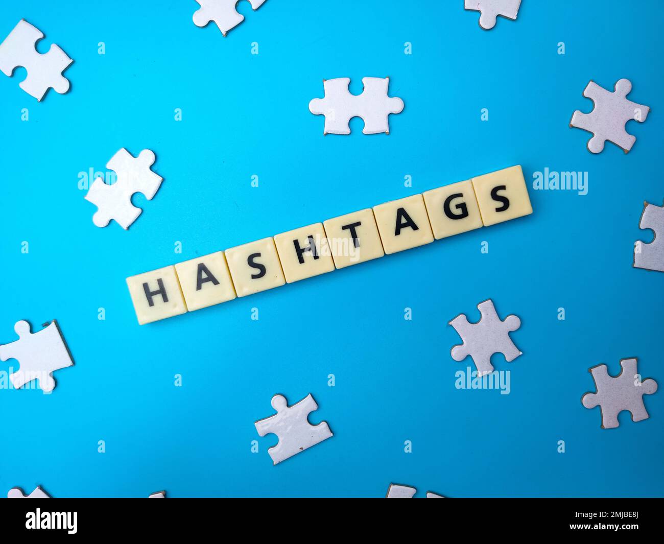 Top view toys word and jig saw puzzle with word HASHTAGS Stock Photo