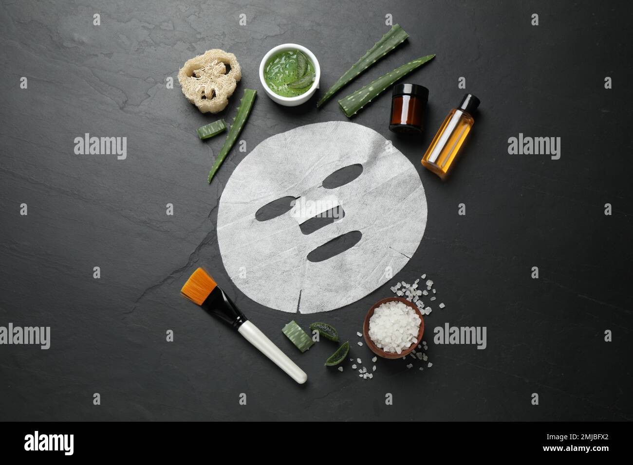 Flat lay composition with different cosmetic products and aloe on black ...