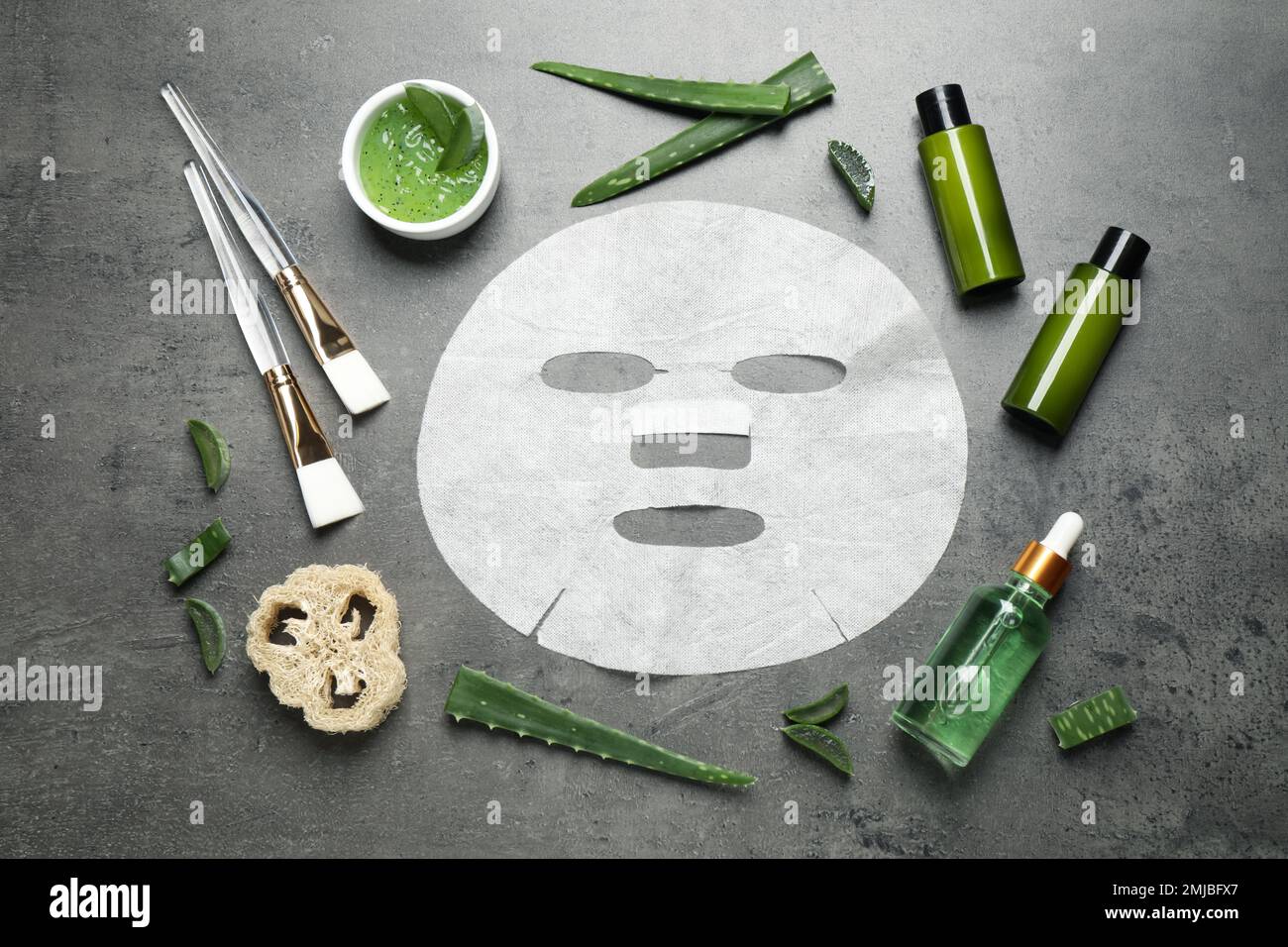 Flat lay composition with different cosmetic products and aloe on grey ...