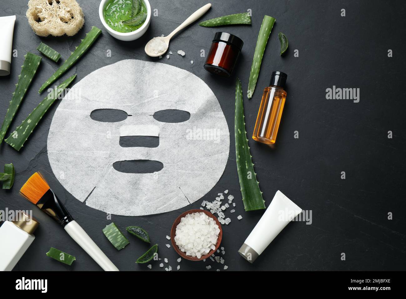 Flat lay composition with different cosmetic products and aloe on black ...