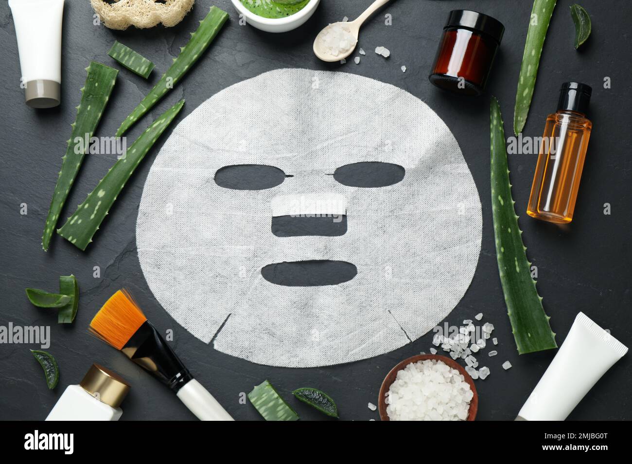 Flat lay composition with different cosmetic products and aloe on black ...