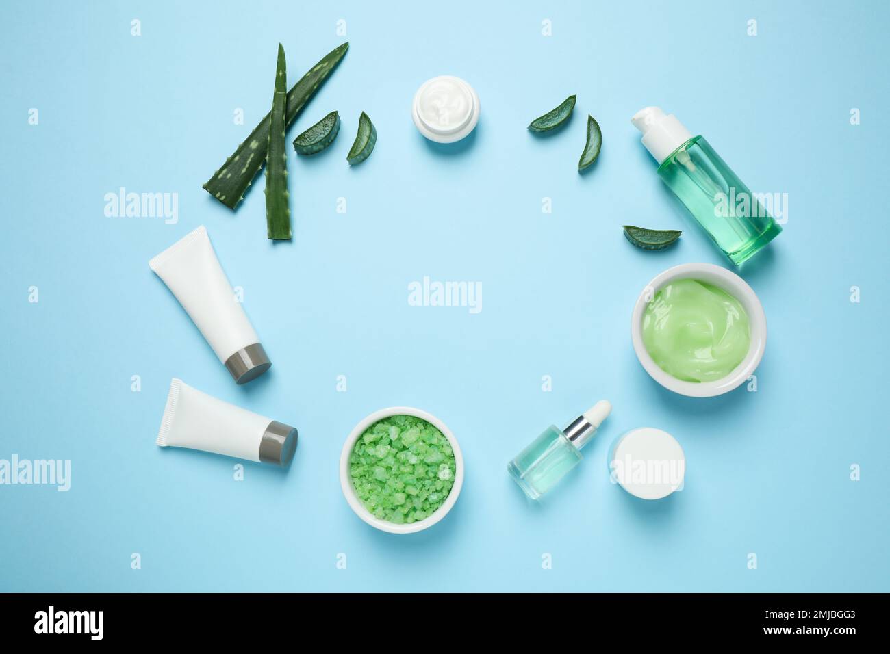 Flat lay composition with different cosmetic products and aloe on light ...