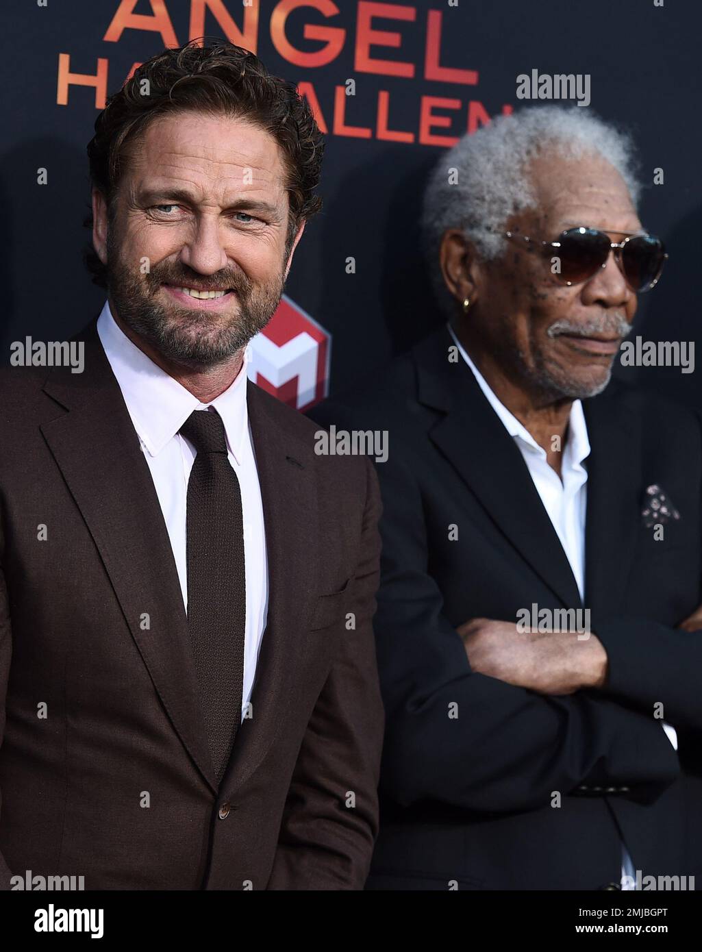 Gerard Butler, left, and Morgan Freeman arrive at the Los Angeles