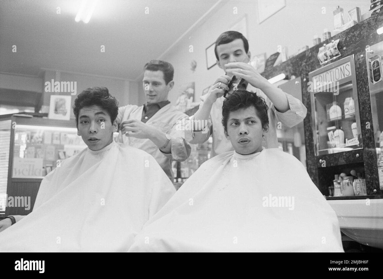 Dutch singing group Blue Diamonds (Ruud de Wolff and Riem de Wolff) at a  hairdresser for conscription in to the army; Date: April 3, 1962 Stock  Photo - Alamy